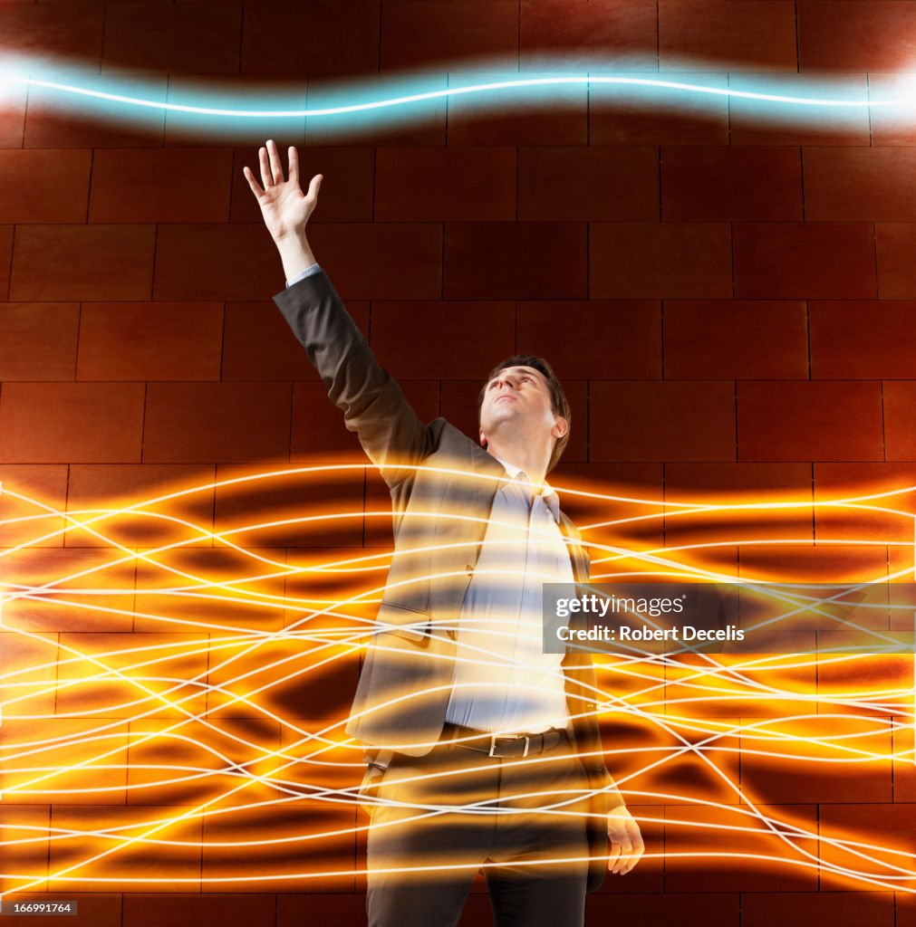 Business man reaches for single communication line