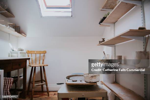 a small pottery studio with a sky light - empty shelves stock pictures, royalty-free photos & images