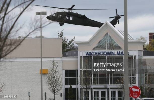 Military helicopter lands behind Watertown Mall as law enforcement agencies search for 19-year-old bombing suspect Dzhokhar A. Tsarnaev on April 19,...