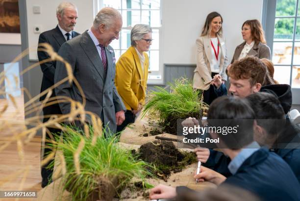 King Charles III meets students carrying out root and soil structure analysis during a visit to officially open the MacRobert Farming and Rural...