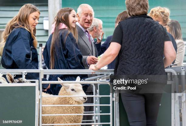 King Charles III meets farming and rural skills students in the livestock shed during a visit to officially open the MacRobert Farming and Rural...