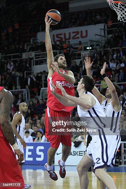 Stratos Perperoglou of Olympiacos competes with Stanko Barac of Anadolu Efse during the Turkish Airlines Euroleague 2012-2013 Play Offs game 4...