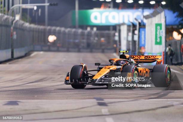 Lando Norris of Great Britain drives the McLaren MCL36 during the qualifying race ahead of the F1 Grand Prix of Singapore at the Marina Bay Street...