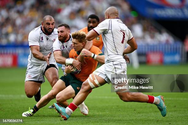 Vasil Lobzhanidze of Georgia tackles Tate McDermott of Australia, which later results in a TMO review for a potential high tackle attempt, during the...