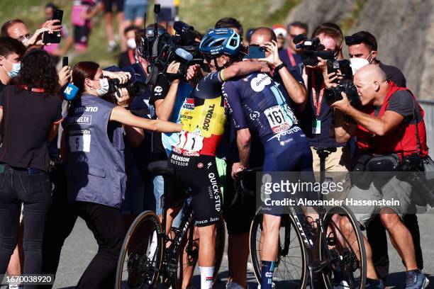 Stage winner Remco Evenepoel of Belgium and Team Soudal - Quick Step and Romain Bardet of France and Team DSM - Firmenich react after the 78th Tour...