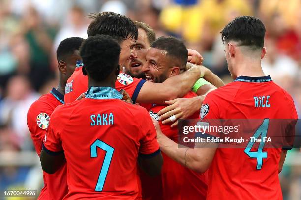 Kyle Walker of England celebrates with teammates after scoring the team's first goal during the UEFA EURO 2024 European qualifier match between...