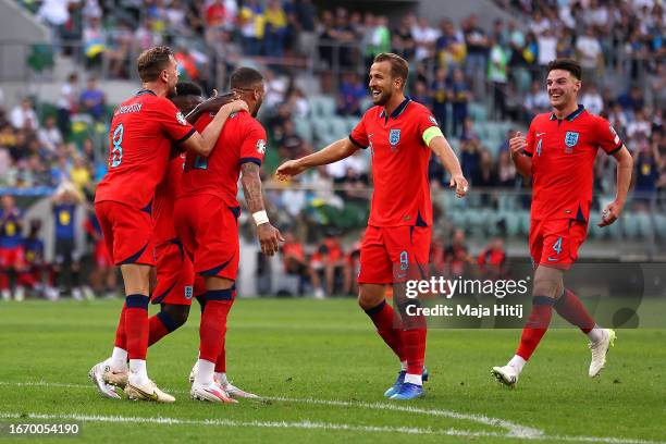 Kyle Walker of England celebrates with teammates after scoring the team's first goal during the UEFA EURO 2024 European qualifier match between...