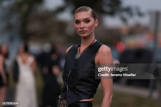 Elsa Hosk is seen outside Ralph Lauren show wearing black amulet necklace, black leather Ralph Lauren vest, big medal Ralph Laurent belt, black Ralph...