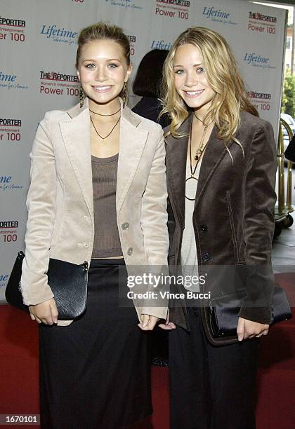 Actors Ashley and Mary Kate Olsen attend the Hollywood Reporters' Annual Women In Entertainment: Power 100 Breakfast on December 3, 2002 in Beverly...