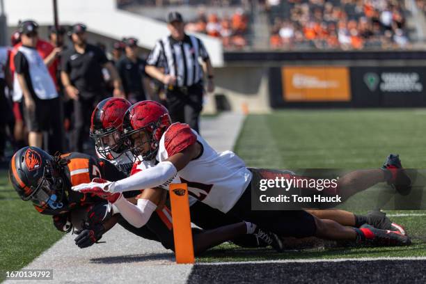 Wide receiver Silas Bolden of the Oregon State Beavers dives for the end zone as he is stopped by cornerback Chris Johnson of the San Diego State...