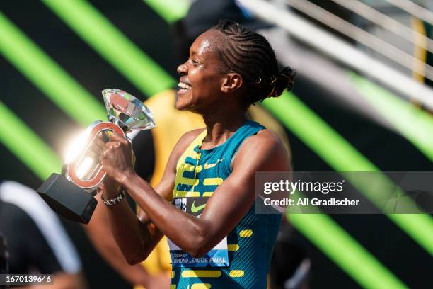 Faith Kipyegon of Kenya holds up the Diamond League Final trophy after winning the Women's 1500mat Hayward Field on September 16, 2023 in Eugene,...