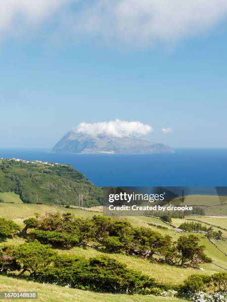 distant view of corvo island from flores - azores portugal stock pictures, royalty-free photos & images