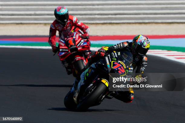 Marco Bezzecchi of Italy and Mooney VR46 Racing Team rides in front of Francesco Bagnaia of Italy and Ducati Lenovo Team during Sprint Race of the...