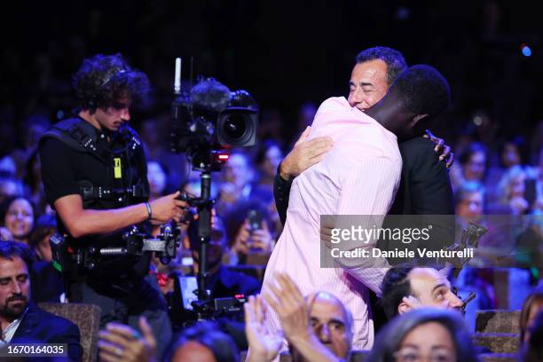 Seydou Sarr and Matteo Garrone during the Awards ceremony at the 80th Venice International Film Festival on September 09, 2023 in Venice, Italy.