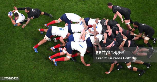 Antoine Dupont of France is tackled by Aaron Smith of New Zealand during the Rugby World Cup France 2023 match between France and New Zealand at...