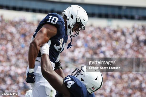 Nicholas Singleton of the Penn State Nittany Lions celebrates with Olumuyiwa Fashanu after scoring a touchdown against the Delaware Fightin Blue Hens...