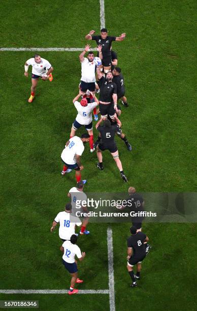 Charles Ollivon of France competes with Samuel Whitelock of New Zealand at a lineout during the Rugby World Cup France 2023 match between France and...