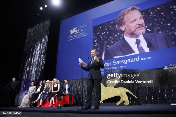 Peter Sarsgaard speaks on stage as he receives the Best Actor Award for 'Memory' during the Awards ceremony at the 80th Venice International Film...