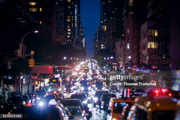 Cars are queued up on a street in the evening on September 16, 2023 in New York City, United States.