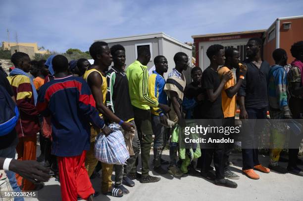 Migrants are seen in Lampedusa, Italy on September 16, 2023. The small Sicilian island of Lampedusa is overwhelmed with nearly 7000 migrants arrived...