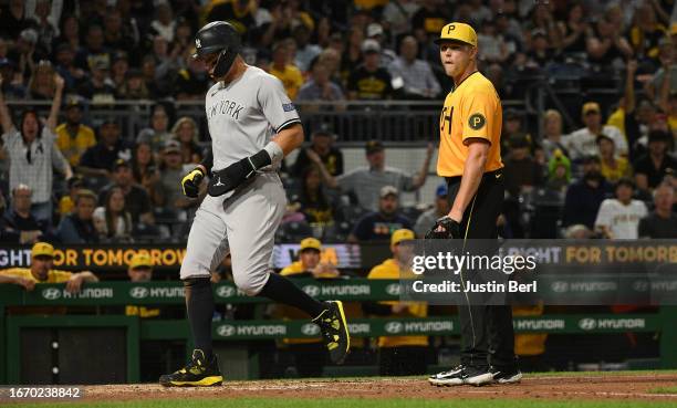 Hunter Stratton of the Pittsburgh Pirates reacts as Aaron Judge of the New York Yankees comes around to score on a wild pitch in the sixth inning...