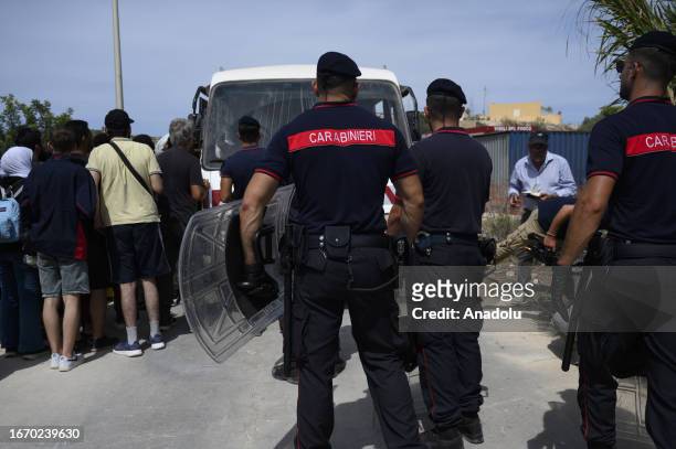 Members of Carabinieri forces seen trying to block the way from the hotspot in Lampedusa, Italy on September 16, 2023. The small Sicilian island of...