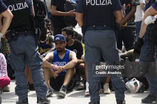 Migrants are seen in Lampedusa, Italy on September 16, 2023. The small Sicilian island of Lampedusa is overwhelmed with nearly 7000 migrants arrived...