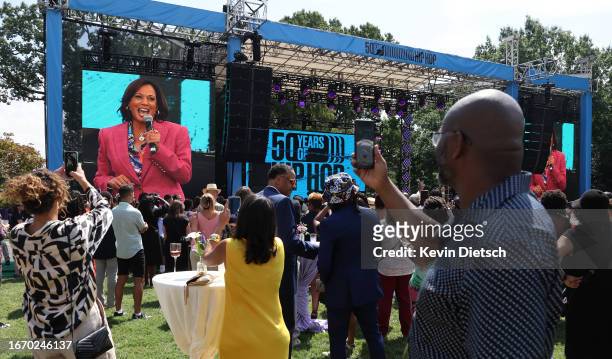 Guest watch as U.S. Vice President Kamala Harris delivers remarks at an event celebrating the 50th anniversary of Hip Hop, at the Vice President's...