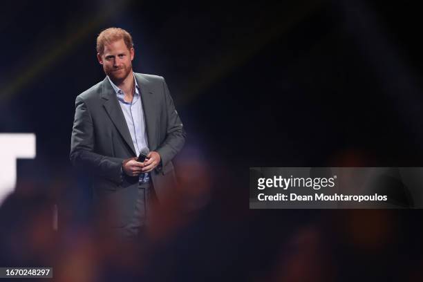 Prince Harry, Duke of Sussex talks on stage during the opening ceremony of the Invictus Games Düsseldorf 2023 at Merkur Spiel-Arena on September 09,...