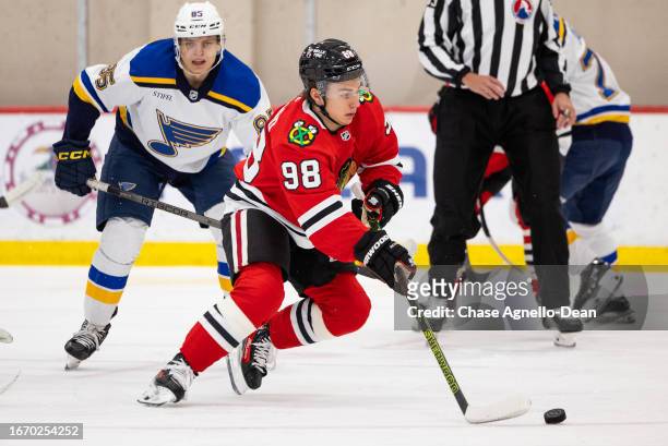 Connor Bedard of the Chicago Blackhawks carries the puck during the first period of the Tom Kruvers Prospect Showcase against the St Louis Blues on...