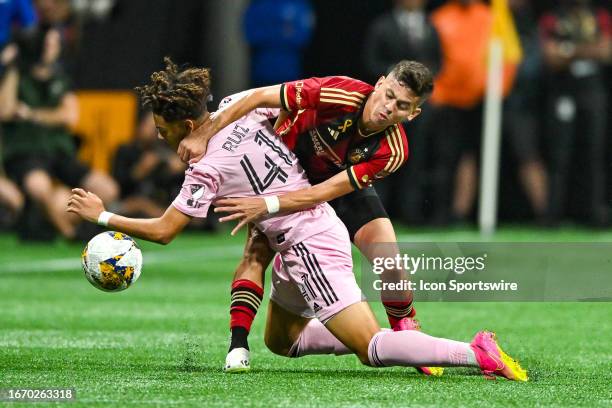 Miami midfielder David Ruiz receives a challenge from Atlanta midfielder Matheus Rossetto during the MLS match between Inter Miami CF and Atlanta...