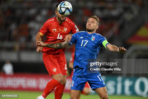 Ciro Immobile of Italy competes for the ball with Gjoko Zajkov of North Macedonia during the UEFA EURO 2024 European qualifier match between North...
