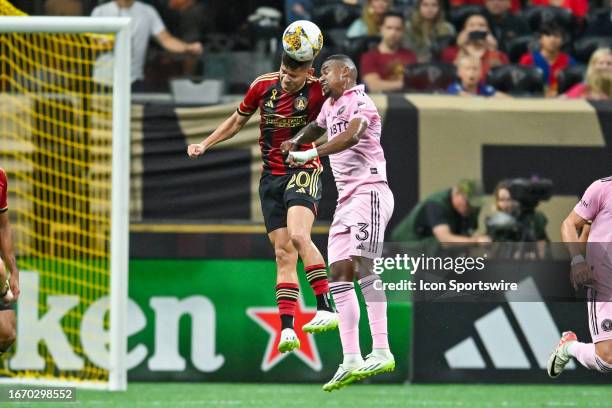 Atlanta midfielder Matheus Rossetto and Miami midfielder Dixon Arroyo battle for a header during the MLS match between Inter Miami CF and Atlanta...