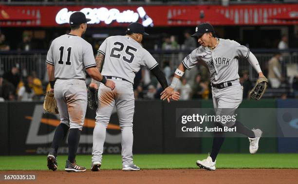 Oswaldo Cabrera of the New York Yankees celebrates with Gleyber Torres and Anthony Volpe after the final out in a 6-3 win over the Pittsburgh Pirates...