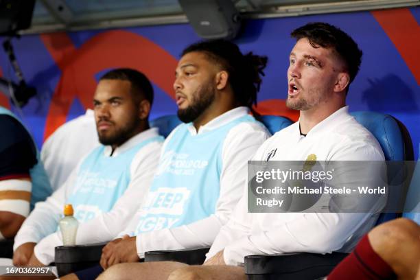 Tom Curry of England looks on from the substitutes bench having received a red card after a TMO Bunker Review decided to upgrade the original yellow...