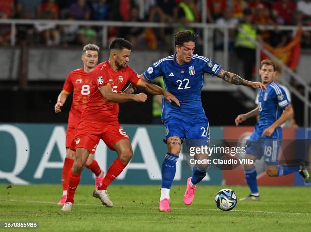 Nicolo Zaniolo of Italy competes for the ball with Visar Musliu of North Macedonia during the UEFA EURO 2024 European qualifier match between North...