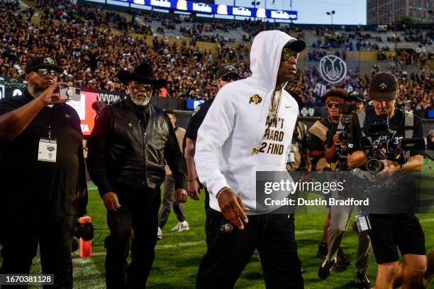 Head coach Deion Sanders of the Colorado Buffaloes walks on the field as players warm up before a game against the Colorado State Rams at Folsom...