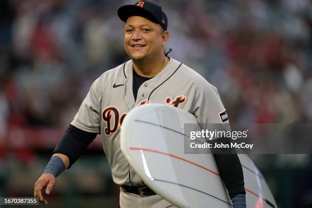 Miguel Cabrera of the Detroit Tigers was given a surf board during his retirement ceremony before playing the Los Angeles Angels at Angel Stadium of...