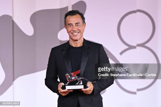 Matteo Garrone poses with the Silver Lion for Best Director for film ‘Io Capitano’ during the winner's photocall at the 80th Venice International...