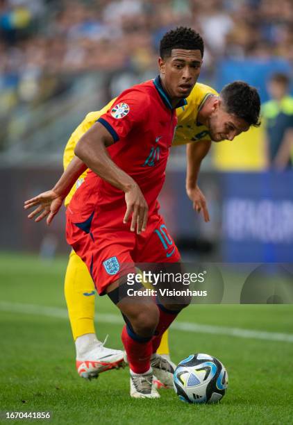 Jude Bellingham of England and Roman Yaremchuk of Ukraine in action during the UEFA EURO 2024 European qualifier match between Ukraine and England at...