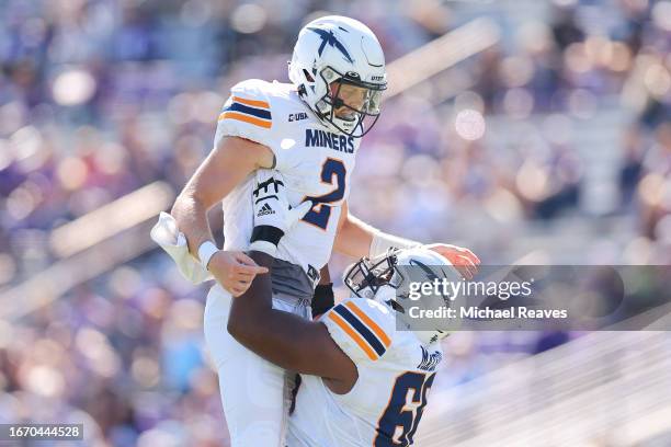 Gavin Hardison of the UTEP Miners celebrates a touchdown pass with Justin Mayers against the Northwestern Wildcats during the first half at Ryan...