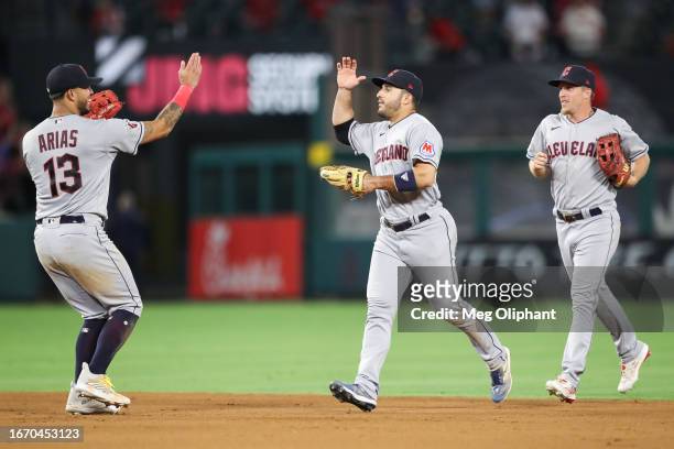Gabriel Arias and Ramon Laureano of the Cleveland Guardians celebrate after defeating the Los Angeles Angels at Angel Stadium of Anaheim on September...