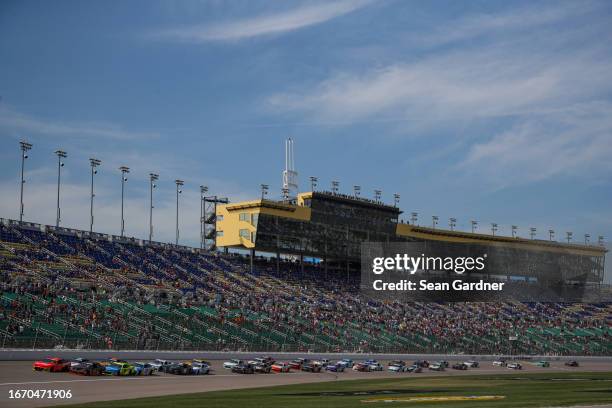 Justin Allgaier, driver of the BRANDT Chevrolet, and Sammy Smith, driver of the TMC Toyota, lead the field to start the NASCAR Xfinity Series Kansas...