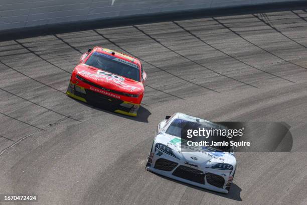 John Hunter Nemechek, driver of the Pye Barker Fire & Safety Toyota, and Justin Allgaier, driver of the BRANDT Chevrolet, race during the NASCAR...