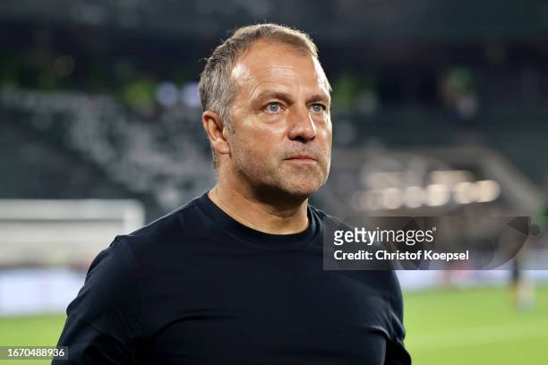 Hansi Flick, Head Coach of Germany looks on after the team's defeat in the international friendly match between Germany and Japan at Volkswagen Arena...