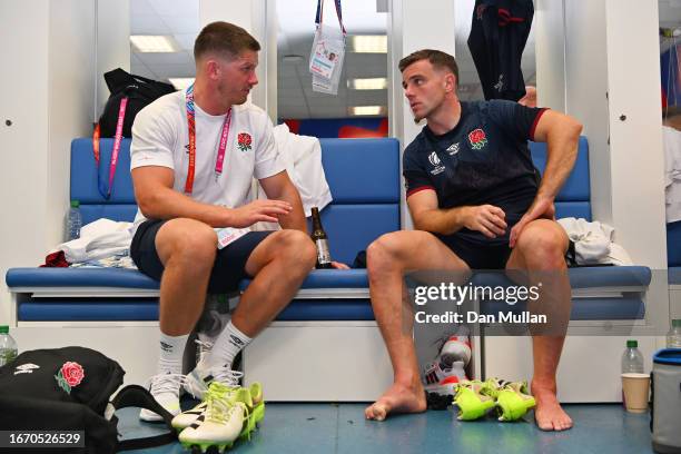 Owen Farrell and George Ford of England speak in the changing room at full-time following the Rugby World Cup France 2023 match between England and...