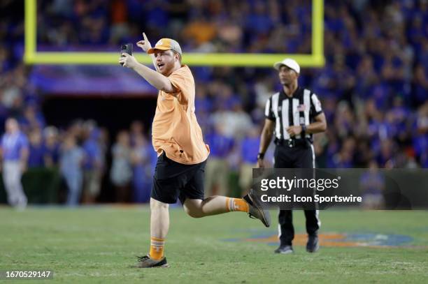 Tennessee Volunteers fan runs on the field during the game between the Tennessee Volunteers and the Florida Gators on September 16, 2023 at Ben Hill...