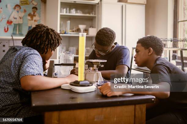 african-american students in science school classroom - junior high stock pictures, royalty-free photos & images