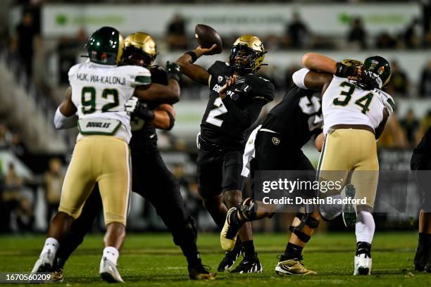 Quarterback Shedeur Sanders of the Colorado Buffaloes throws a pass for a first quarter touchdown against the Colorado State Rams at Folsom Field on...