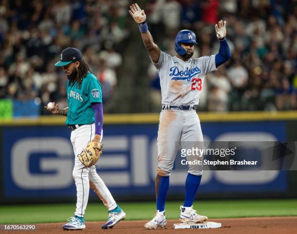 Jason Heyward of the Los Angeles Dodgers celebrates at second base after hitting a double against the Seattle Mariners during the seventh inning of a...